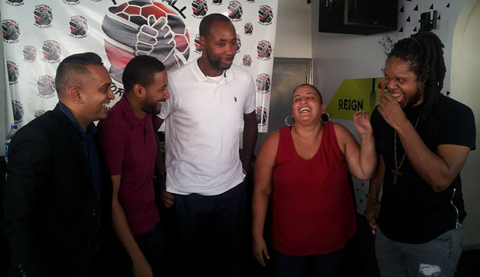 MX Prime, right, shares a light moment with other organisers of the Football For a Cause relief football match at #63 Bar in Woodbrook, yesterday. Also in the photograph are (from left) Shaun Fuentes, director of communications at the TT Football Association, Kyle Lequay, sports marketing consultant, TT men’s football coach Dennis Lawrence and assistant secretary general of the TT Olympic Committee Nadine Khan. MX Prime, right, shares a light moment with other organisers of the Football For a Cause relief football match at #63 Bar in Woodbrook, yesterday. Also in the photograph are (from left) Shaun Fuentes, director of communications at the TT Football Association, Kyle Lequay, sports marketing consultant, TT men’s football coach Dennis Lawrence and assistant secretary general of the TT Olympic Committee Nadine Khan.