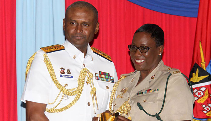 Chief of Defence Staff, Rear Admiral Hayden Pritchard, presents Major Leslie Ann McLeod-Mohammed, with an award for 30 years of Colour Service at the Launch of the Chief of Defence Staff's Military Women's Initiative, Hilton Hotel. Chief of Defence Staff, Rear Admiral Hayden Pritchard, presents Major Leslie Ann McLeod-Mohammed, with an award for 30 years of Colour Service at the Launch of the Chief of Defence Staff's Military Women's Initiative, Hilton Hotel.