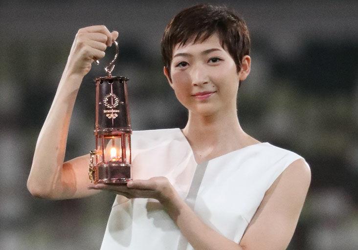 THE COUNTDOWN STARTS: Japanese swimmer Rikako Ikee holds a lantern containing the Olympic flame during an event yesterday marking one year until the postponed Tokyo 2020 Olympic and Paralympic Games, at the National Stadium in Tokyo.  —Photo: AFP THE COUNTDOWN STARTS: Japanese swimmer Rikako Ikee holds a lantern containing the Olympic flame during an event yesterday marking one year until the postponed Tokyo 2020 Olympic and Paralympic Games, at the National Stadium in Tokyo.  —Photo: AFP