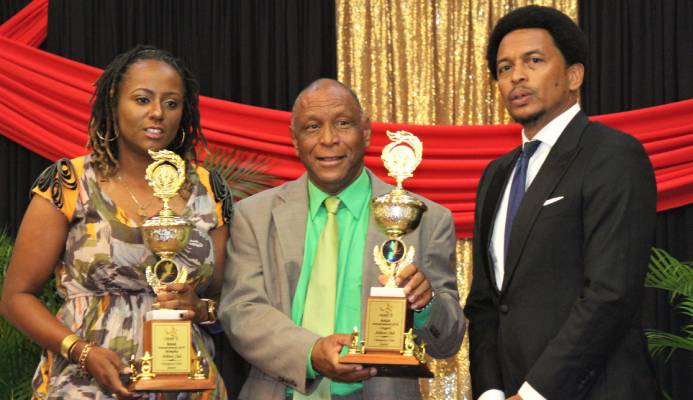 "Memphis Pioneers’ Antonia Burton, left, and Cougars Athletics’ Kelvin Nancoo, centre, with Trinidad and Tobago Olympic Committee president Brian Lewis after receiving the joint Champion Junior Club award on behalf of their clubs at the NAAA’s 2019 Awards Function at the Radisson Hotel, Port-of-Spain, on Saturday evening. " "Memphis Pioneers’ Antonia Burton, left, and Cougars Athletics’ Kelvin Nancoo, centre, with Trinidad and Tobago Olympic Committee president Brian Lewis after receiving the joint Champion Junior Club award on behalf of their clubs at the NAAA’s 2019 Awards Function at the Radisson Hotel, Port-of-Spain, on Saturday evening. "