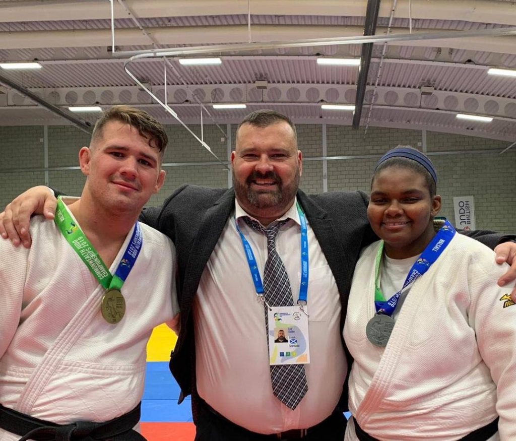 TT's first female Olympic-bound judoka Gabriella Wood, right, with training partner Cailin Calder and coach Lee Calder, centre. - TT's first female Olympic-bound judoka Gabriella Wood, right, with training partner Cailin Calder and coach Lee Calder, centre. -