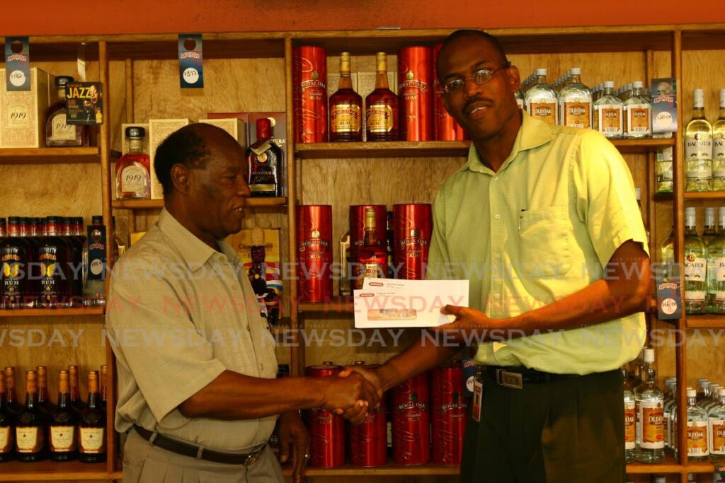FILE: In 2008, veteran sport journalist George Baptiste, received an award from Angostura for an article on the Royal Oak Derby event at the Arima Racing Club, Santa Rosa Arima. FILE: In 2008, veteran sport journalist George Baptiste, received an award from Angostura for an article on the Royal Oak Derby event at the Arima Racing Club, Santa Rosa Arima.