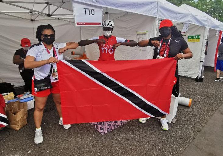 NATIONAL PRIDE: Trinidad and Tobago cyclist Teniel Campbell is flanked by Team TTO chef de mission Lovie Santana, left, and Covid-19 Liaison Officer (CLO) Rheeza Grant before the start of the Tokyo 2020 Women’s Road Race, in Japan, yesterday. —Photo courtesy Team TTO NATIONAL PRIDE: Trinidad and Tobago cyclist Teniel Campbell is flanked by Team TTO chef de mission Lovie Santana, left, and Covid-19 Liaison Officer (CLO) Rheeza Grant before the start of the Tokyo 2020 Women’s Road Race, in Japan, yesterday. —Photo courtesy Team TTO