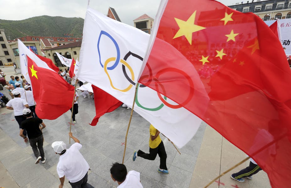 Local residents holding Chinese and Olympic flags attend a rehearsal in Chongli county of Zhangjiakou ahead of the 2008 Olympic Games in Beijing. Reuters/Jason Lee Local residents holding Chinese and Olympic flags attend a rehearsal in Chongli county of Zhangjiakou ahead of the 2008 Olympic Games in Beijing. Reuters/Jason Lee