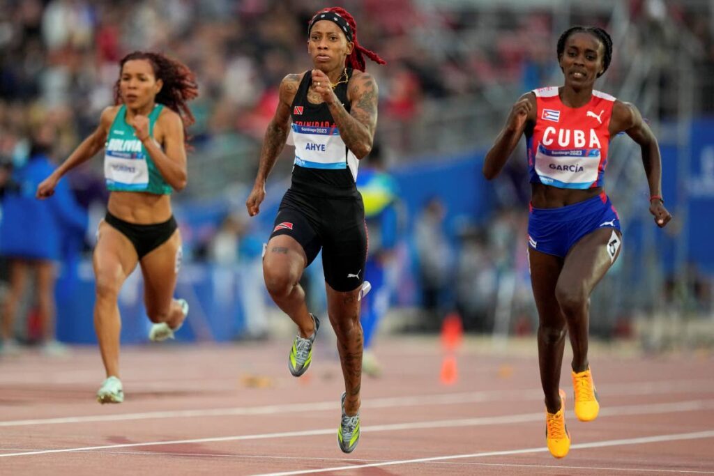Cuba's Yunisleidy Garcia and TT's Michelle-lee Ahye run in a women's 100m semifinal at the Pan American Games in Santiago, Chile, on Monday. - AP PHOTO (Image obtained at newsday.co.tt) Cuba's Yunisleidy Garcia and TT's Michelle-lee Ahye run in a women's 100m semifinal at the Pan American Games in Santiago, Chile, on Monday. - AP PHOTO (Image obtained at newsday.co.tt)