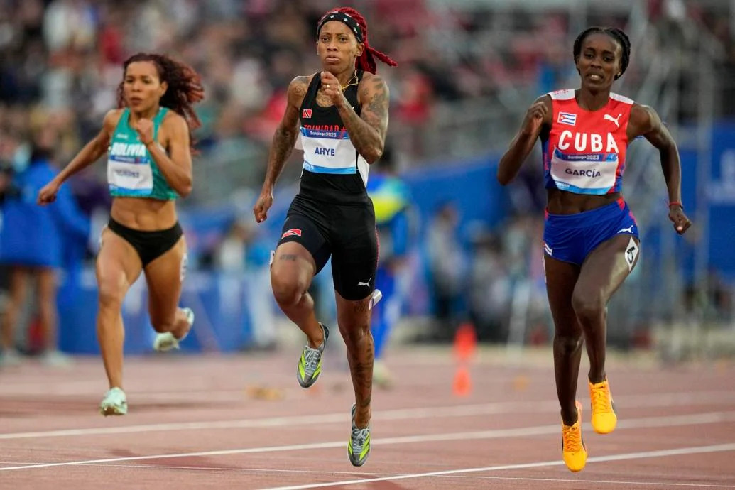 CRUISING: Cuba’s Yunisleidy Garcia, right, leads home Trinidad and Tobago’s  Michelle-Lee Ahye in a women’s 100 metres semi-final heat,  last evening, at the Pan American Games in Santiago, Chile. —Photo: AP  Natacha Pisarenko (Image obtained at trinidadexpress.com) CRUISING: Cuba’s Yunisleidy Garcia, right, leads home Trinidad and Tobago’s  Michelle-Lee Ahye in a women’s 100 metres semi-final heat,  last evening, at the Pan American Games in Santiago, Chile. —Photo: AP  Natacha Pisarenko (Image obtained at trinidadexpress.com)
