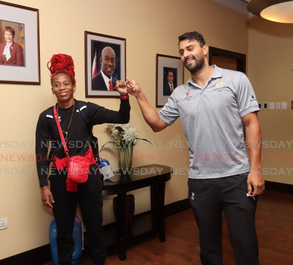 Sprinter Michelle Lee-Ahye and swimmer Dylan Carter greet each other after arriving home at the Piarco International Airport on August 14. - Photo by Faith Ayoung (Image obtained at newsday.co.tt) Sprinter Michelle Lee-Ahye and swimmer Dylan Carter greet each other after arriving home at the Piarco International Airport on August 14. - Photo by Faith Ayoung (Image obtained at newsday.co.tt)
