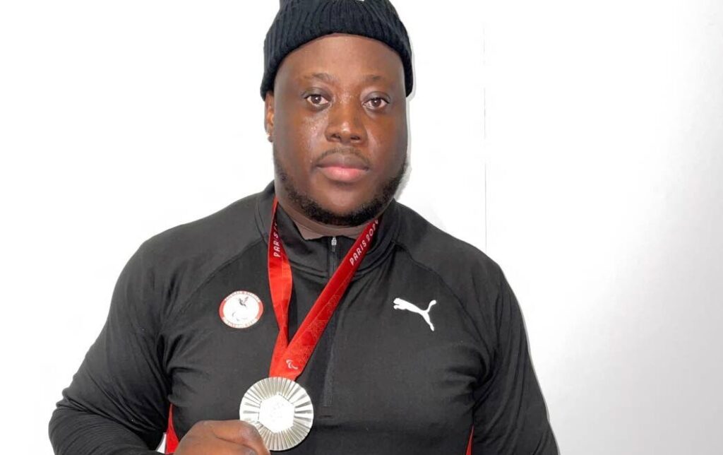 Trinidad and Tobago's Akeem Stewart displays his Paralympic Games men's discus F64 silver medal at the Stade de France on September 5. - Photo courtesy TT Paralympic Committee (Image obtained at newsday.co.tt) Trinidad and Tobago's Akeem Stewart displays his Paralympic Games men's discus F64 silver medal at the Stade de France on September 5. - Photo courtesy TT Paralympic Committee (Image obtained at newsday.co.tt)