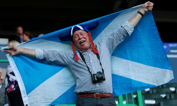 Barrie Schofield in the stands before the 2014 Commonwealth Games opening ceremony in Glasgow. Photograph: David Davies/PA Media (Image obtained at theguardian.com) Barrie Schofield in the stands before the 2014 Commonwealth Games opening ceremony in Glasgow. Photograph: David Davies/PA Media (Image obtained at theguardian.com)