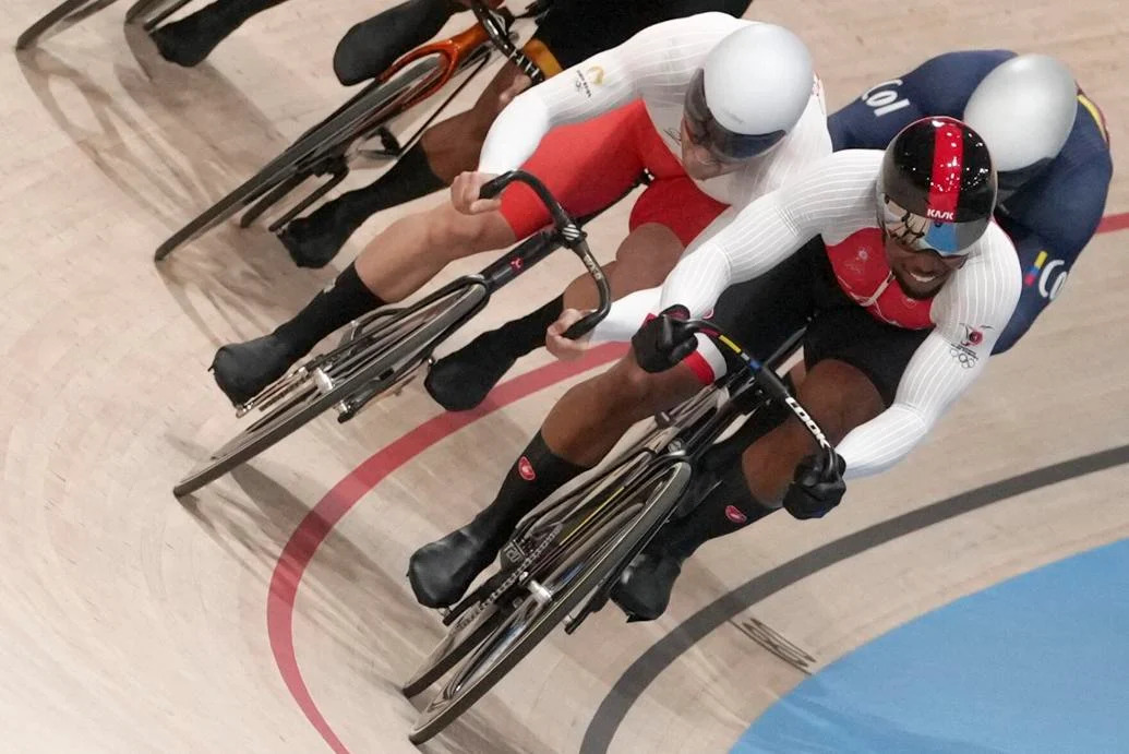 PUSHING THE PACE: Nicholas Paul of Trinidad and Tobago, foreground, leads Mateusz Rudyk of Poland and Cristian David Ortega Fontalvo of Colombia, right, during a men’s keirin first-round heat at the Summer Olympics, yesterday, in Paris, France. —Photo: AP  Thibault Camus (Image obtained at trinidadexpress.com) PUSHING THE PACE: Nicholas Paul of Trinidad and Tobago, foreground, leads Mateusz Rudyk of Poland and Cristian David Ortega Fontalvo of Colombia, right, during a men’s keirin first-round heat at the Summer Olympics, yesterday, in Paris, France. —Photo: AP  Thibault Camus (Image obtained at trinidadexpress.com)