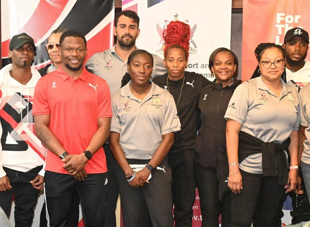 BACk HOME: Cyclist Nicholas Paul, third from left, swimmer Dylan Carter, fourth from left, and Michelle-Lee Ahye, fourth from right, were among several of the athletes who were at the VIP lounge of the Piarco International Airport yesterday on their return from the Paris Olympics. Chef de Mission Lovie Santana, second from right, also accompanied them home. —Photo: CURTIS CHASE (Image obtained at trinidadexpress.com) BACk HOME: Cyclist Nicholas Paul, third from left, swimmer Dylan Carter, fourth from left, and Michelle-Lee Ahye, fourth from right, were among several of the athletes who were at the VIP lounge of the Piarco International Airport yesterday on their return from the Paris Olympics. Chef de Mission Lovie Santana, second from right, also accompanied them home. —Photo: CURTIS CHASE (Image obtained at trinidadexpress.com)