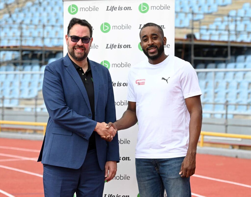 TSTT's CEO Kent Western and National Association of Athletics Administration general secretary Jehue Gordon reaffirm their partnership behind the 2025 Carifta Games. - Photo courtesy bmobile (Image obtained at newsday.co.tt)