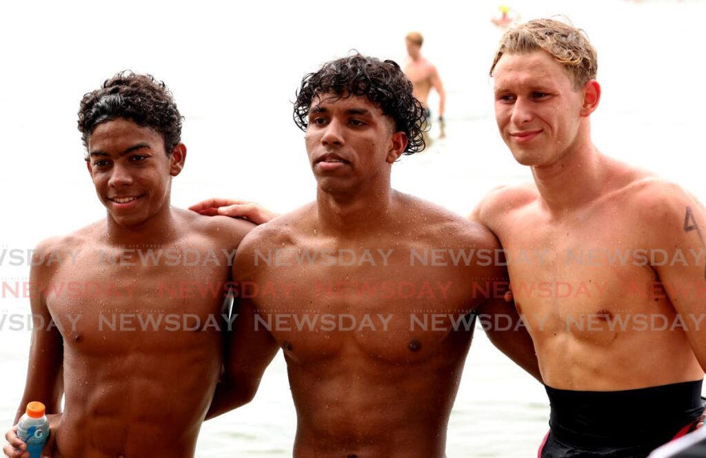 Zachary Anthony, centre, won the Carifta open water 5K males 16-18 race at Chagville Beach, Chaguaramas on April 23. Dominic Hilton of Cayman Islands, right, placed second while Martinique’s Nicolas Anais-Thiery, left, was third. - Photo by Faith Ayoung (Image obtained at newsday.co.tt)
