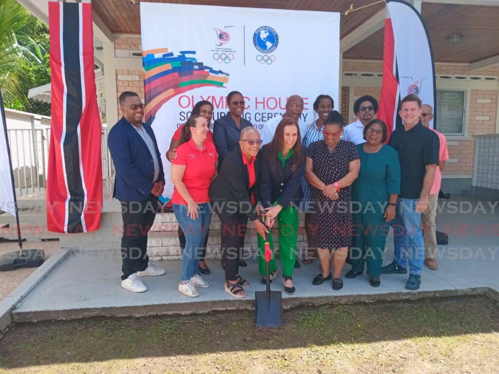 President of the TTOC Diane Henderson and general secretary of PanAm Sports Jimena Saldana (green), along with other TTOC executives, supporters and Olympian Hasely Crawford, back row fourth from left, at the TT Olympic House sod-turning ceremony in Belmont on July 14. - Photo by Jelani Beckles (Image obtained at newsday.co.tt)