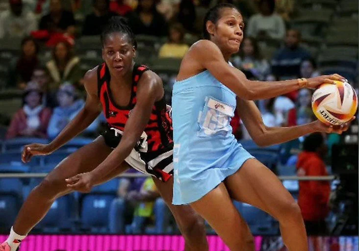 FLASHBACK: Trinidad and Tobago’s wing defender Jeresia McEachrane, left, attempts to intercept a pass to Fiji goal attack Unaisi Rauluni. Fiji defeated T&T 71-37 to claim 11th place at the 2023 INF Netball World Cup in Cape Town, South Africa. --Photo: International Netball Association (Image obtained at trinidadexpress.com)