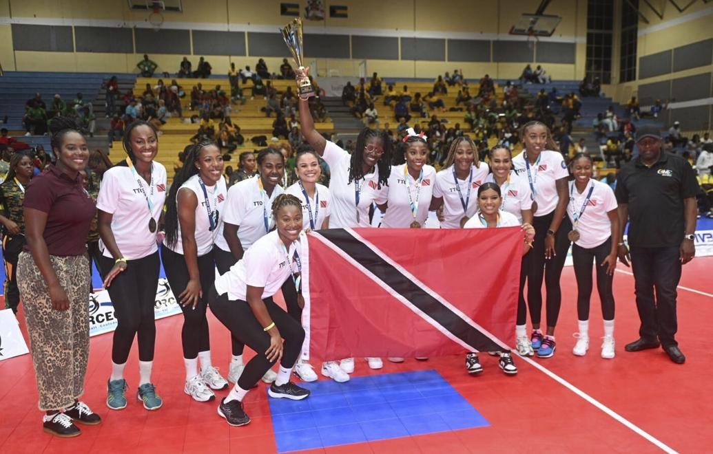 CHAMPS AGAIN: The triumphant T&T women’s volleyball team celebrates their victory in the Caribbean Zonal Volleyball Association (CAZOVA) Championships final against Barbados in the Bahamas on Saturday. —Photo courtesy CAZOVA (Image obtained at trinidadexpress.com)