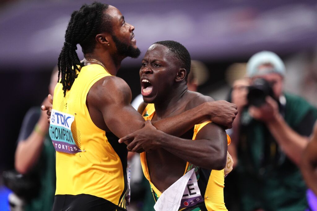 Oblique Seville, right, is congratulated by countryman Kishane Thompson after winning the men’s 100 metres at the World Athletic Championships in Tokyo. (Image obtained at guardian.co.tt)