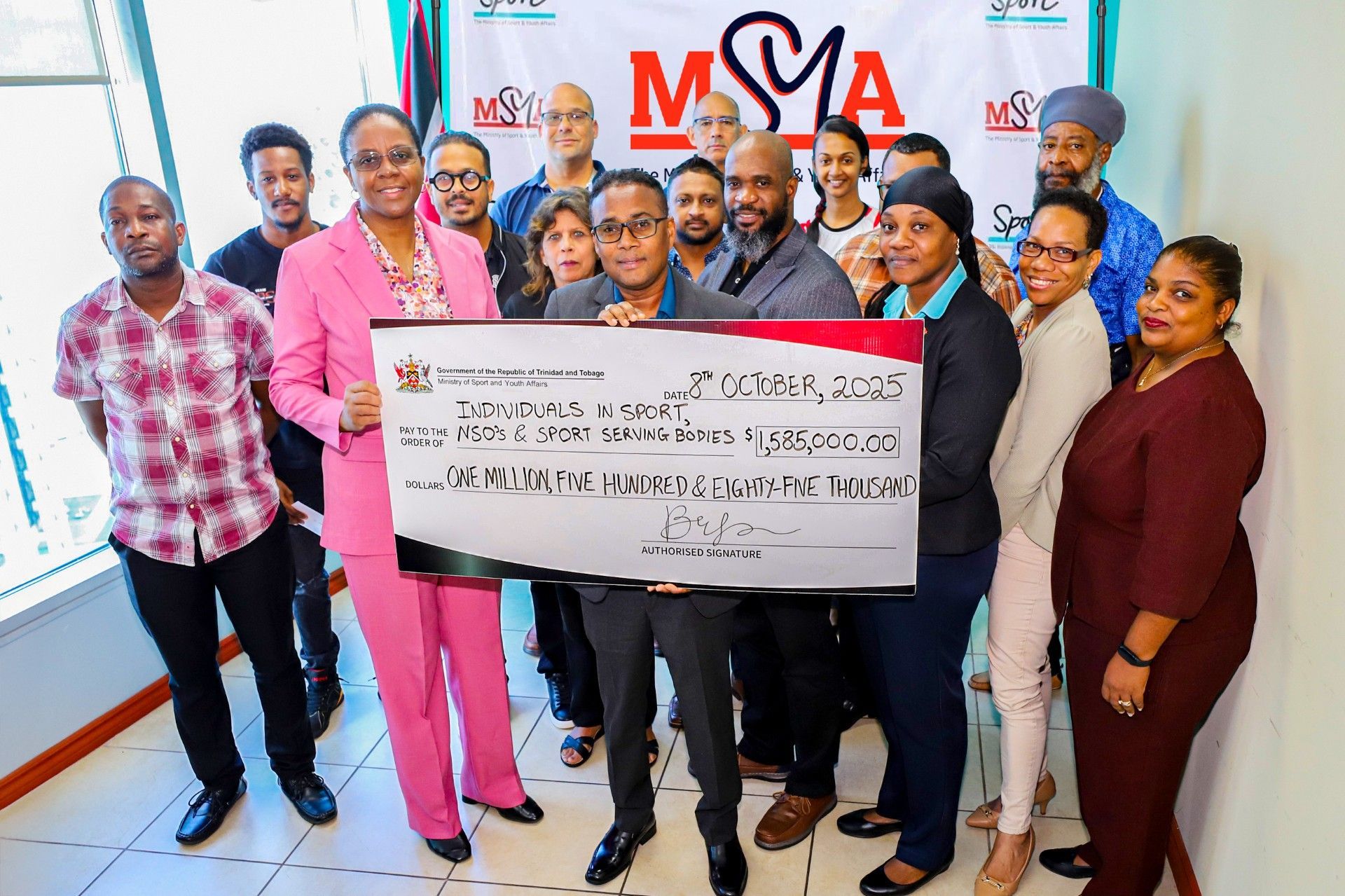 Athletes and sporting organisations on hand to receive the $1.6 million in donations from the Ministry of Sport and Youth Affairs from Sport Minister Phillip Watts. (Image obtained at guardian.co.tt)