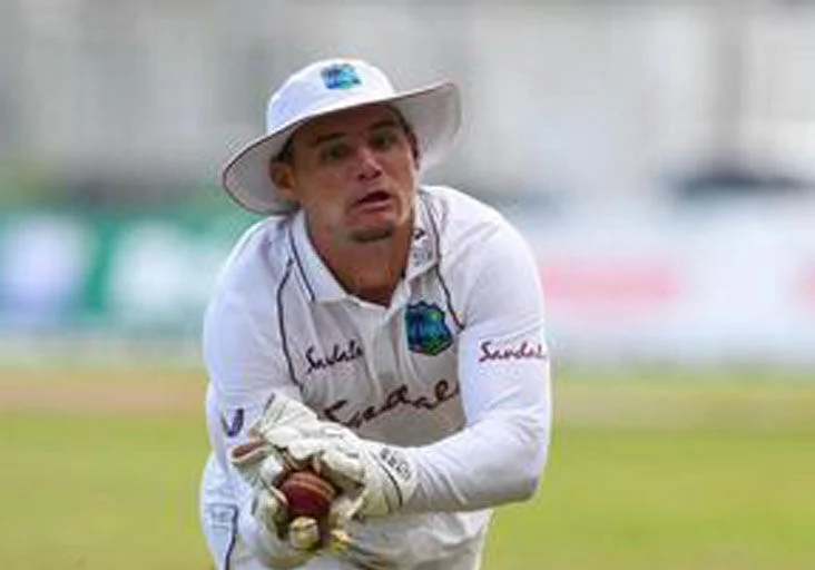 GOOD GRAB: West Indies wicketkeeper Joshua Da Silva grasps this catch after running several metres and diving full stretch to dismiss Pakistan's Hasan Ali on the fourth day of the second and final Test at Sabina Park, Kingston, Jamaica, yesterday. --Photo CWI Media (Image obtained at trinidadexpress.com)
