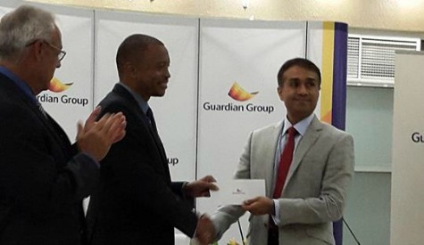 TTOC President, Mr Lewis presented with the cheque from Guardian Group President, Mr.Ravi Tewari to aid #10golds24 Athlete Welfare and Preparation Fund.